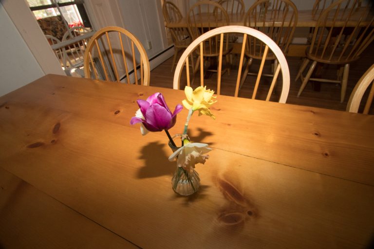 Flowers in a vase on a dining room table at a mental health facility